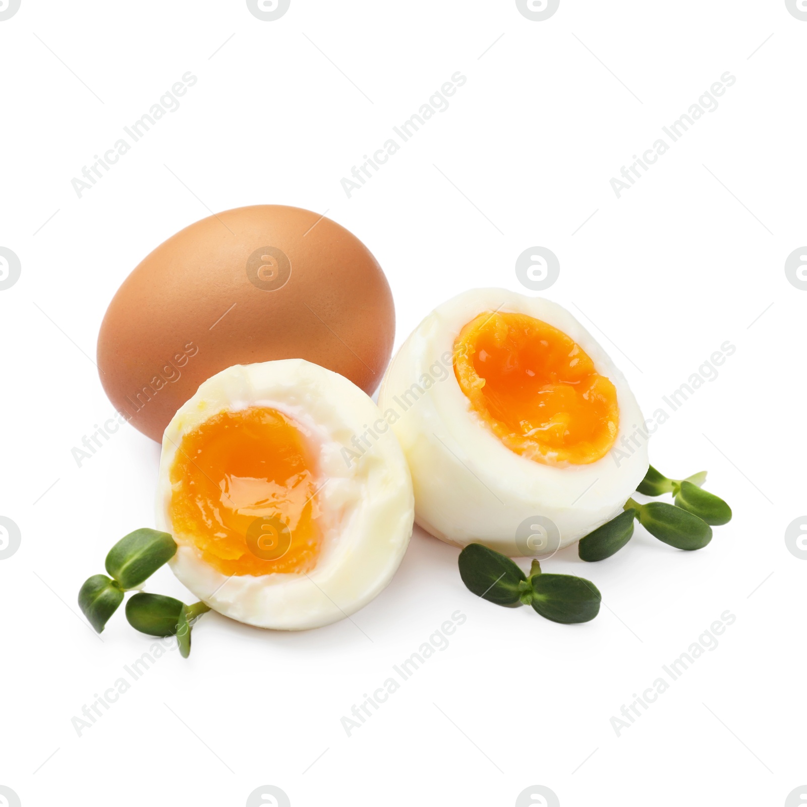 Photo of Soft boiled eggs with microgreens on white background