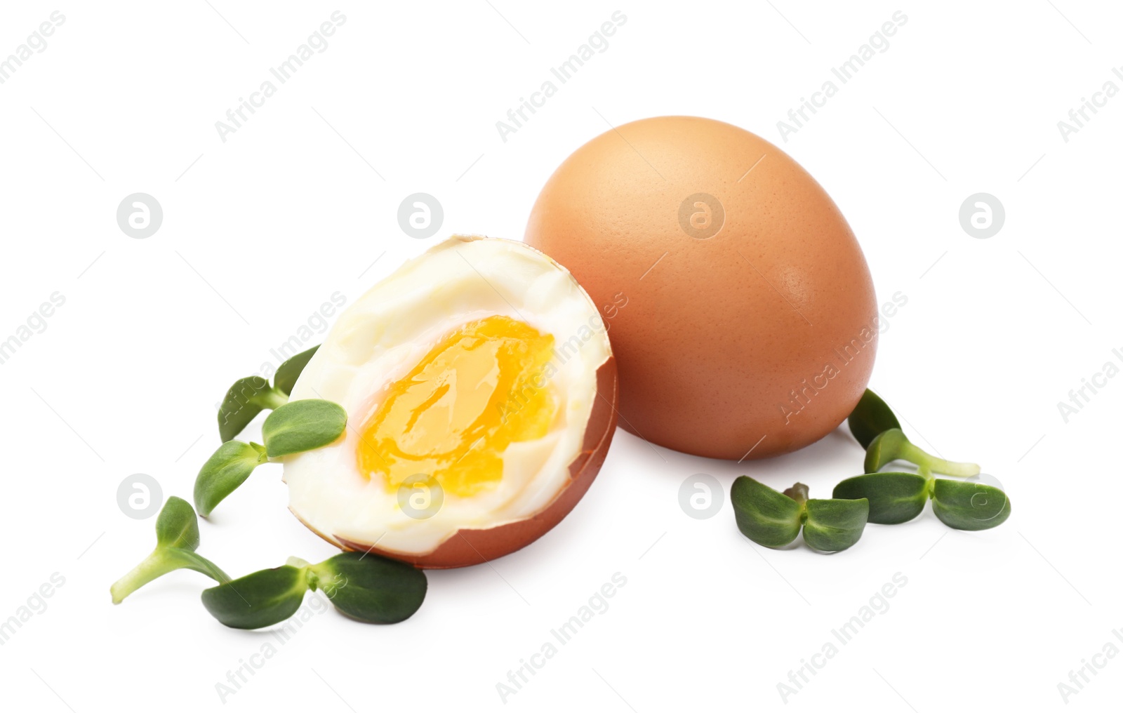 Photo of Soft boiled eggs with microgreens on white background