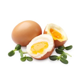 Photo of Soft boiled eggs with microgreens on white background