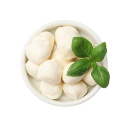 Photo of Tasty mozzarella cheese balls and basil in bowl isolated on white, top view
