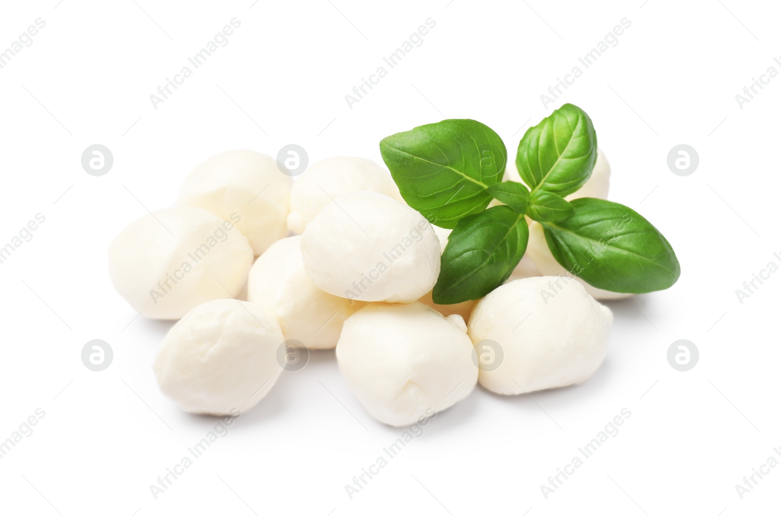 Tasty mozzarella cheese balls and basil isolated on white Photo of Tasty mozzarella cheese balls and basil isolated on white