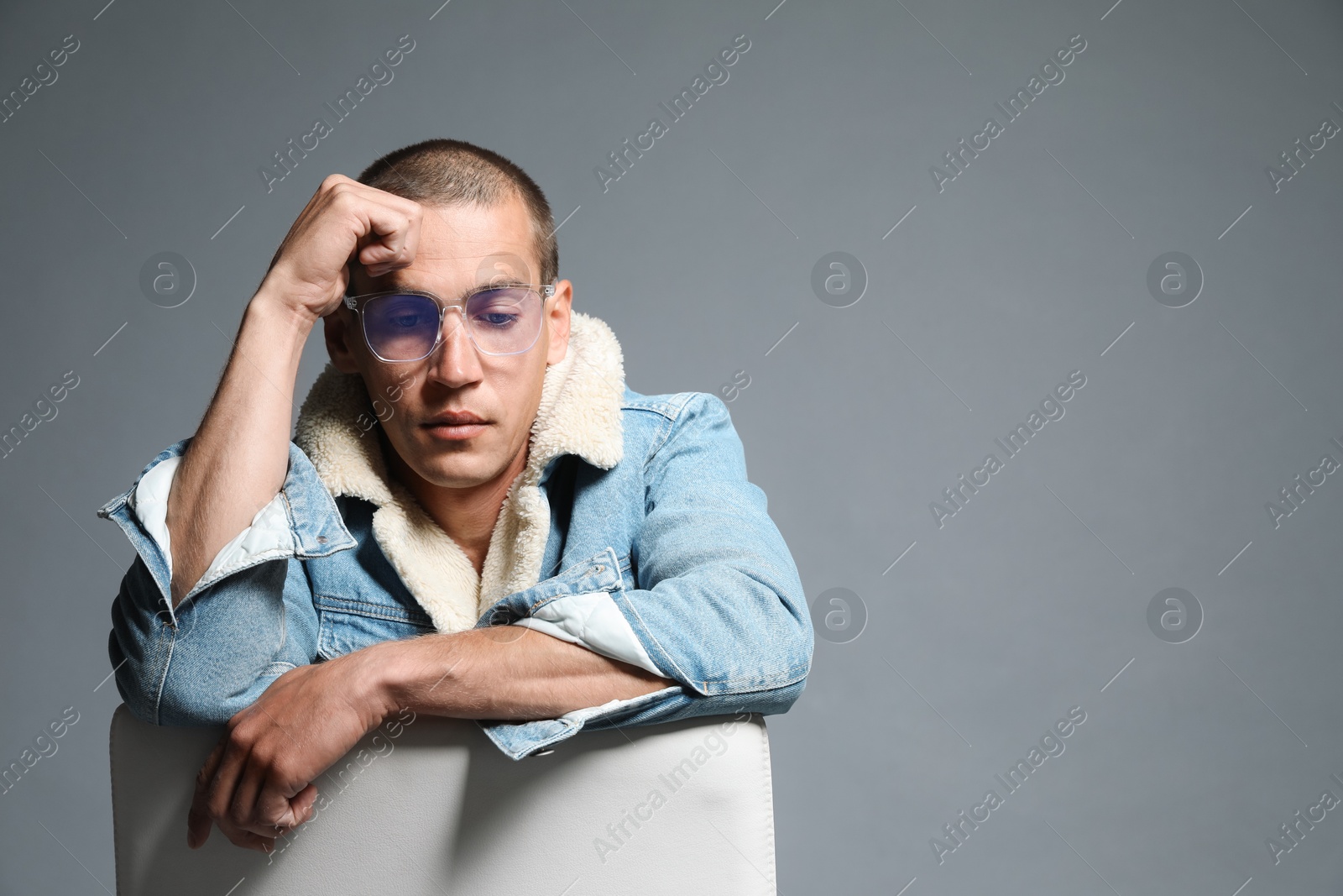 Fashionable portrait of handsome man in stylish outfit on grey background, space for text Photo of Fashionable portrait of handsome man in stylish outfit on grey background, space for text