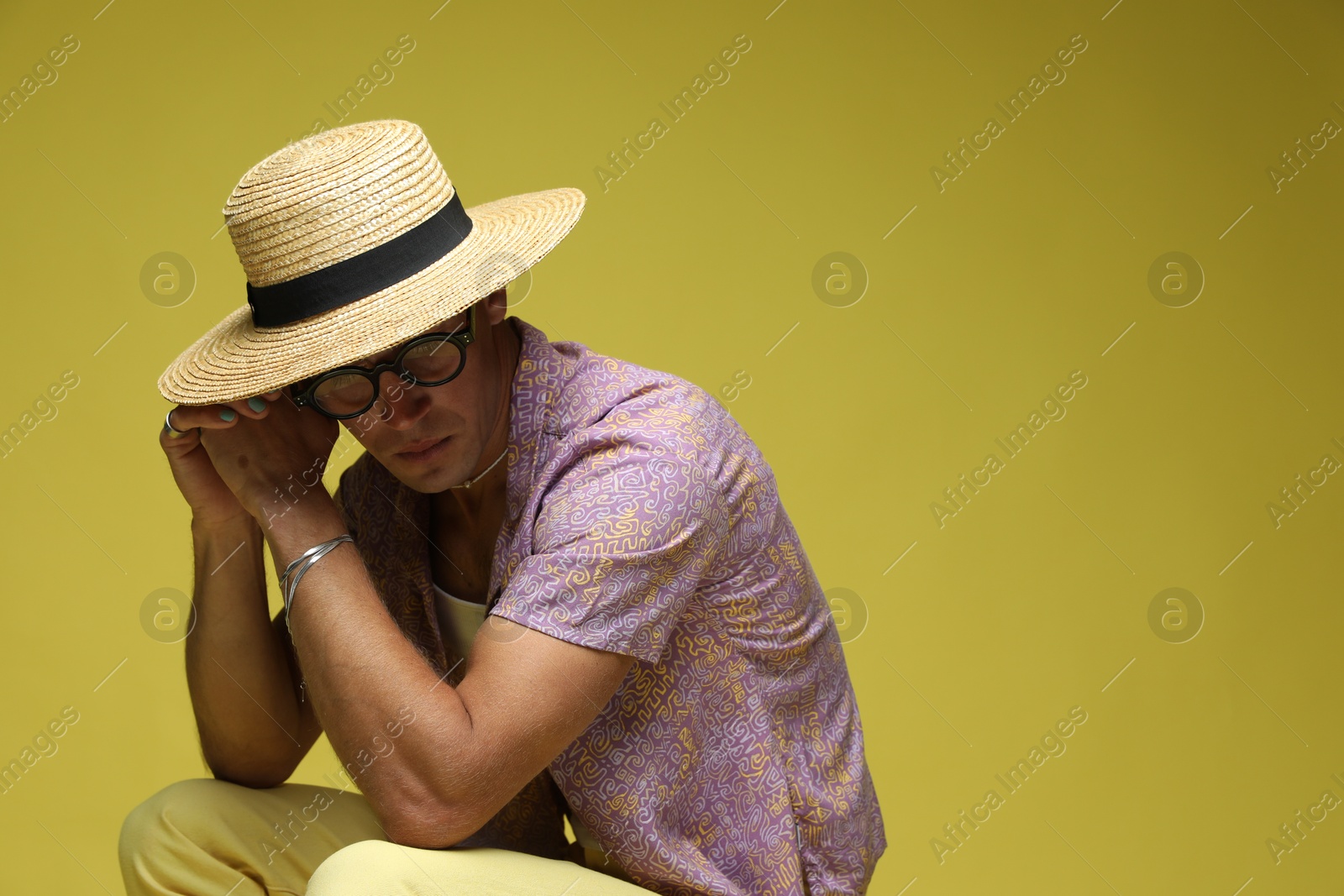 Fashionable portrait of handsome man in stylish outfit on color background, space for text Photo of Fashionable portrait of handsome man in stylish outfit on color background, space for text