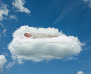 Image of Little girl sleeping on comfortable mattress as soft as cloud in blue sky