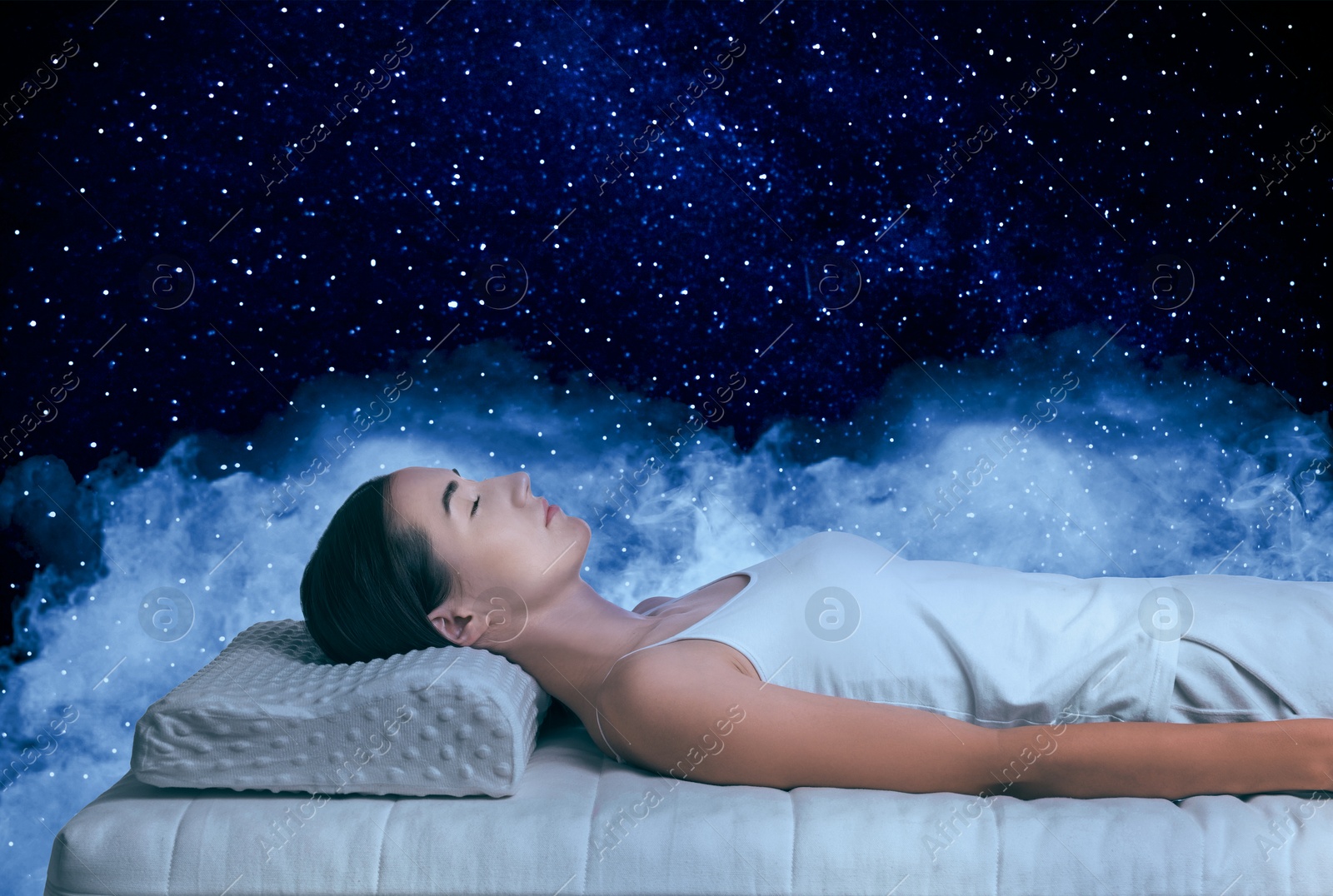 Young woman sleeping on comfortable mattress in starry sky at night Image of Young woman sleeping on comfortable mattress in starry sky at night