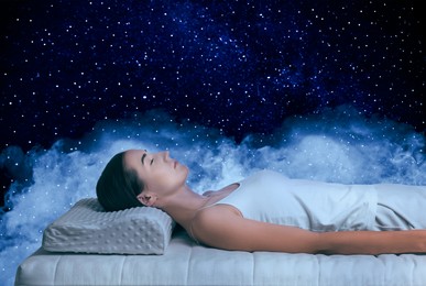 Image of Young woman sleeping on comfortable mattress in starry sky at night