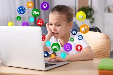 Image of Internet addicted child using laptop at table in room. Different icons flying out of computer