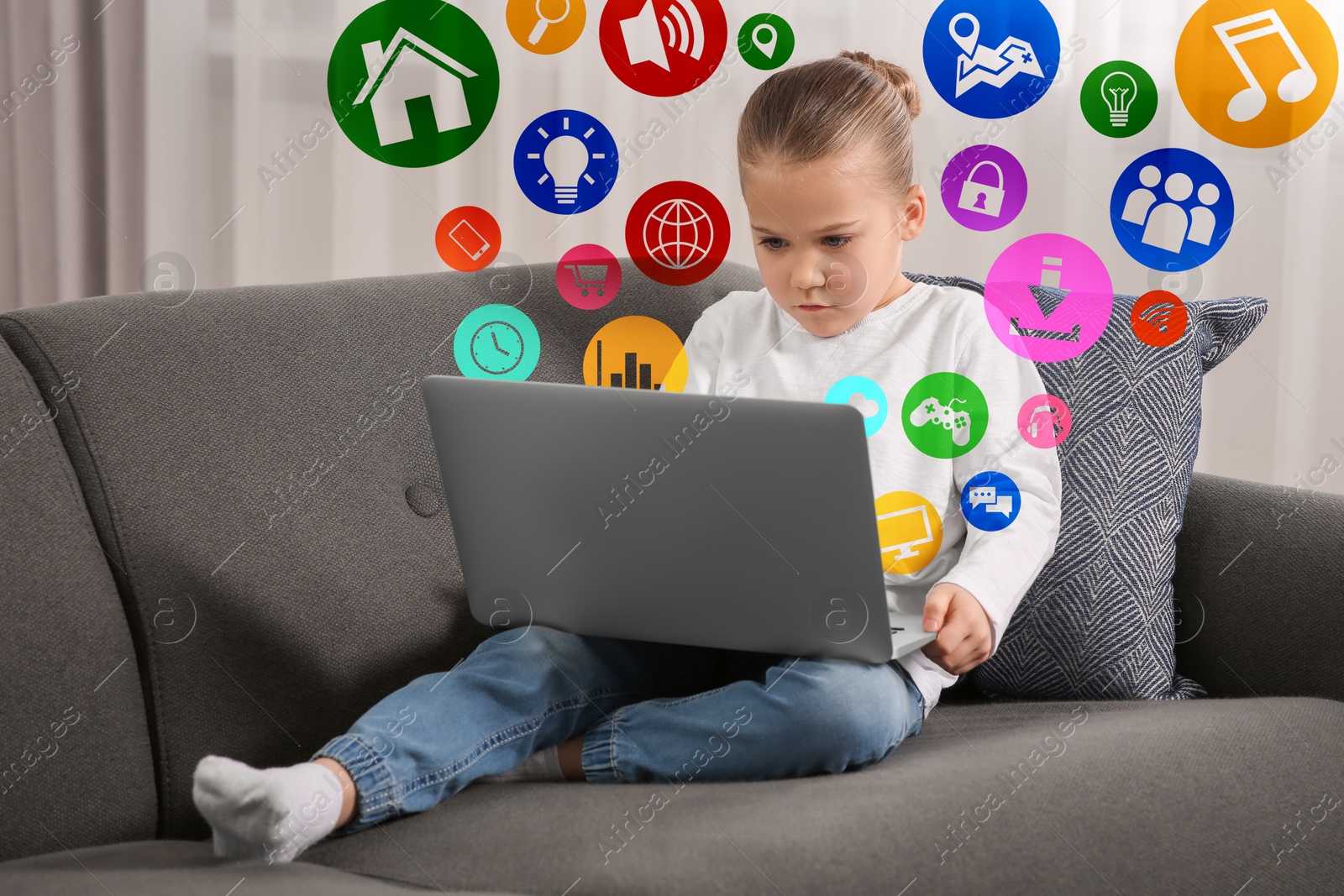 Internet addicted child using laptop at home. Different icons flying out of computer Image of Internet addicted child using laptop at home. Different icons flying out of computer