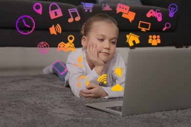 Image of Internet addicted child using laptop on floor at home. Different icons flying out of computer
