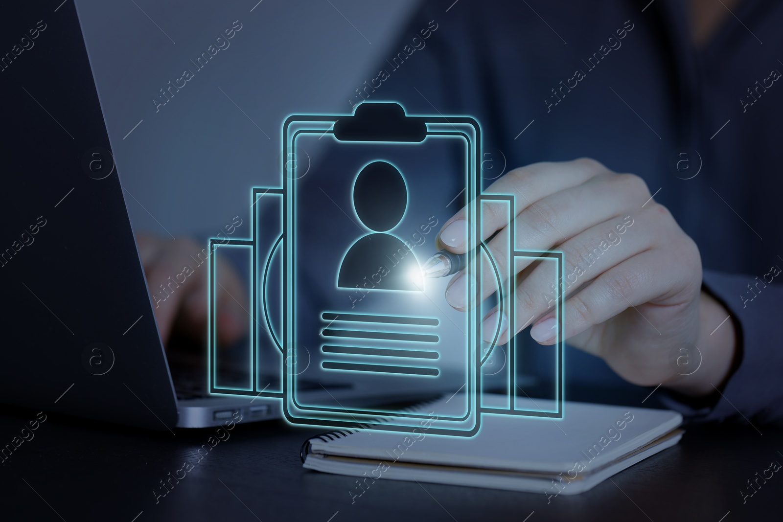 Recruitment, employee search. Human resources manager choosing candidate's resume on virtual screen near laptop, closeup Image of Recruitment, employee search. Human resources manager choosing candidate's resume on virtual screen near laptop, closeup