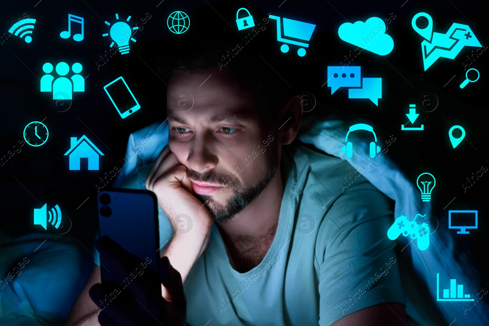 Internet addicted man using mobile phone instead of sleeping at night. Different icons near him Image of Internet addicted man using mobile phone instead of sleeping at night. Different icons near him