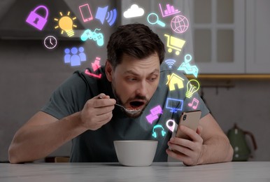 Image of Internet addicted man using mobile phone while eating at home. Different icons flying out of device