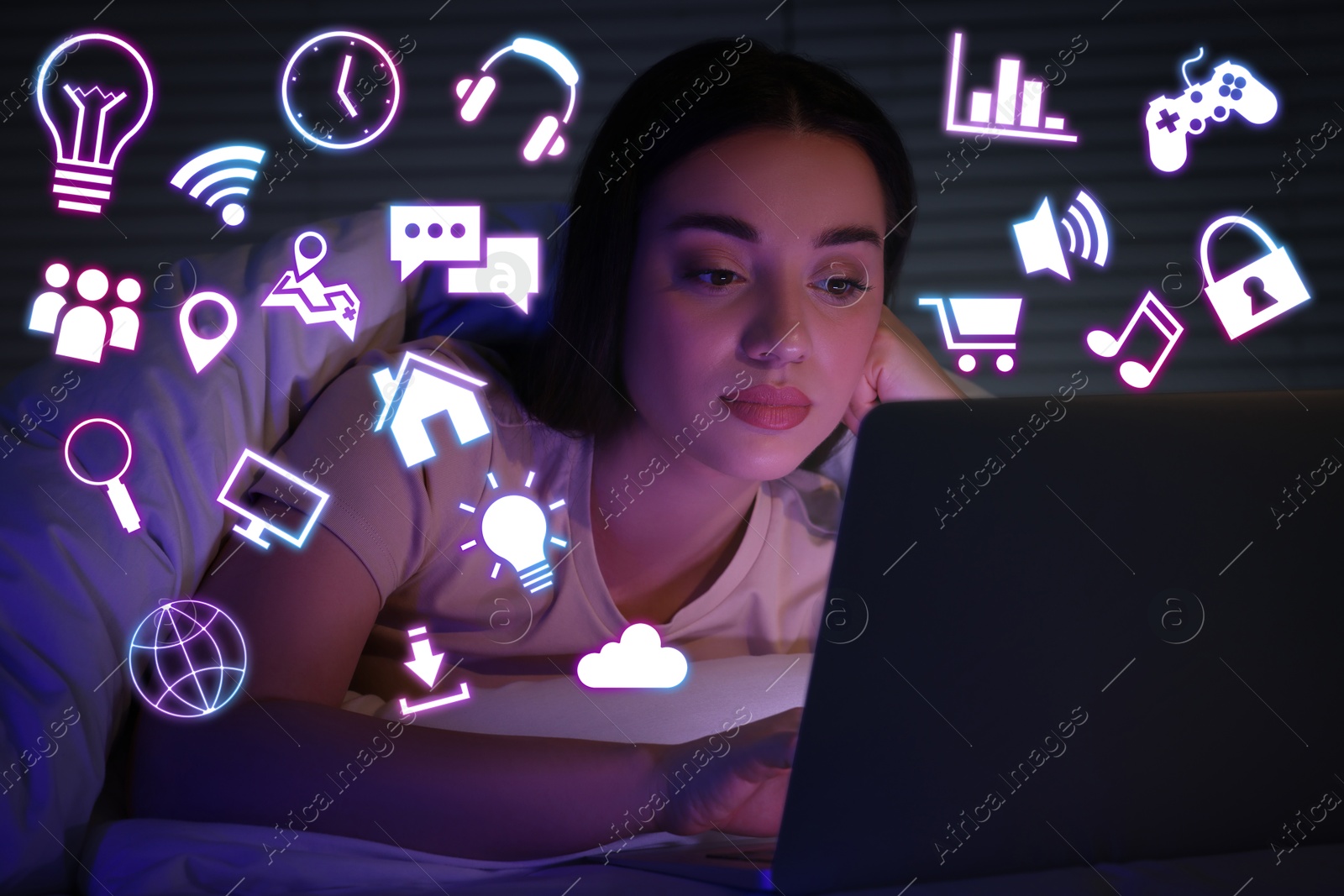 Internet addicted woman using laptop instead of sleeping at night. Different icons near her Image of Internet addicted woman using laptop instead of sleeping at night. Different icons near her