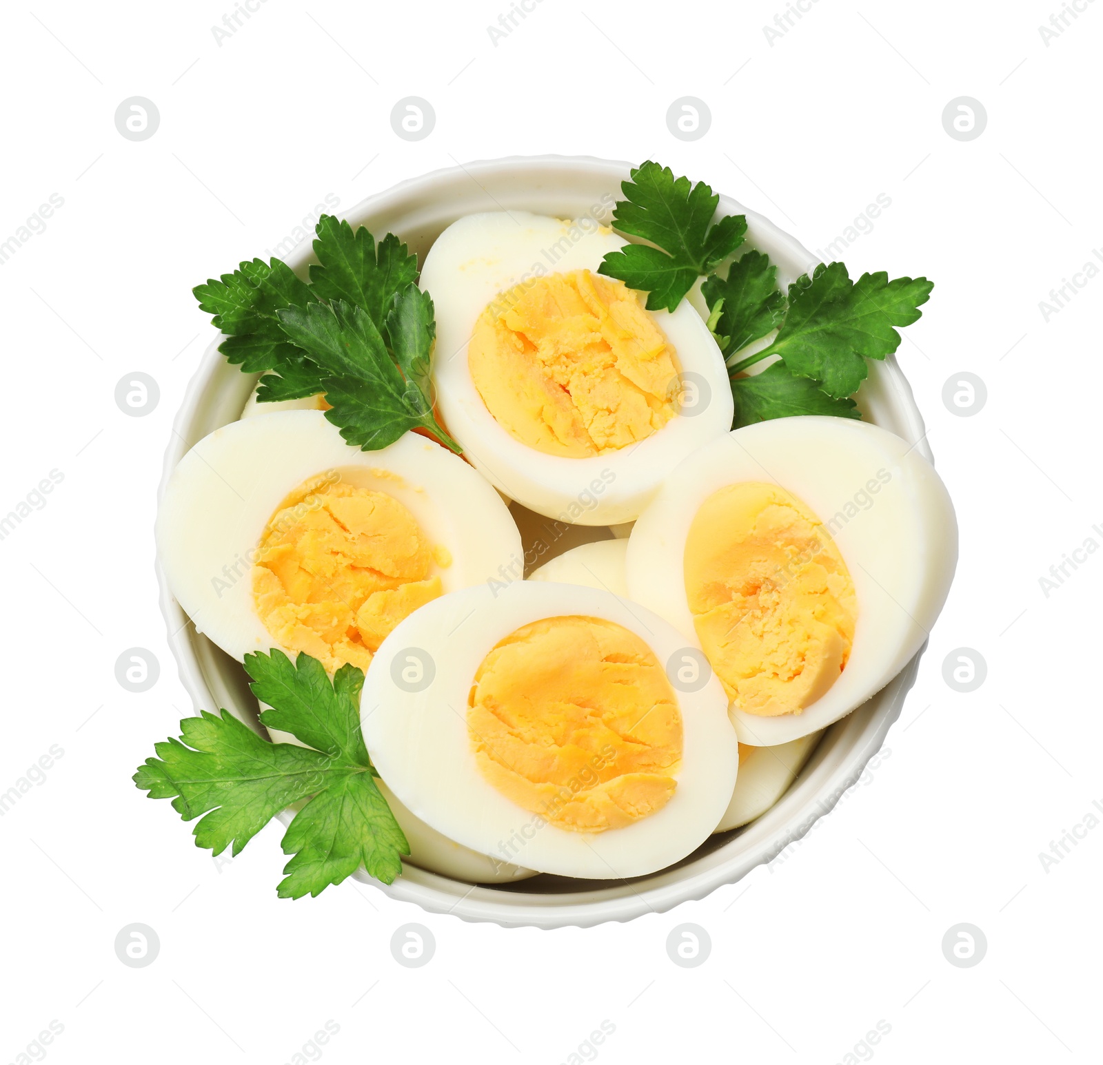Boiled eggs and parsley in bowl on white background, top view Photo of Boiled eggs and parsley in bowl on white background, top view