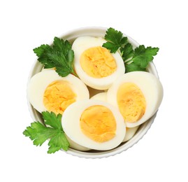 Photo of Boiled eggs and parsley in bowl on white background, top view