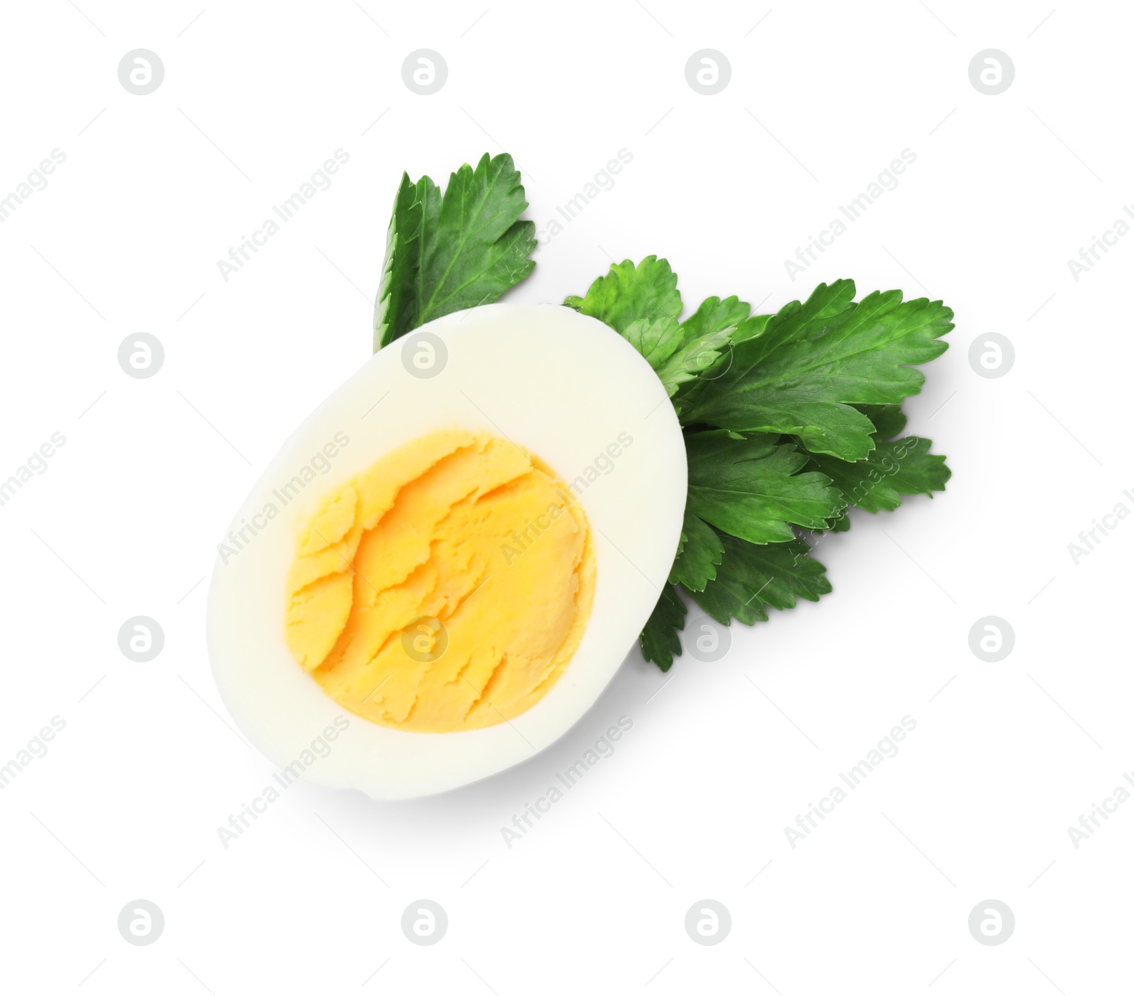 Boiled egg and parsley on white background, top view Photo of Boiled egg and parsley on white background, top view