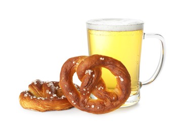 Photo of Tasty pretzels and glass of beer isolated on white