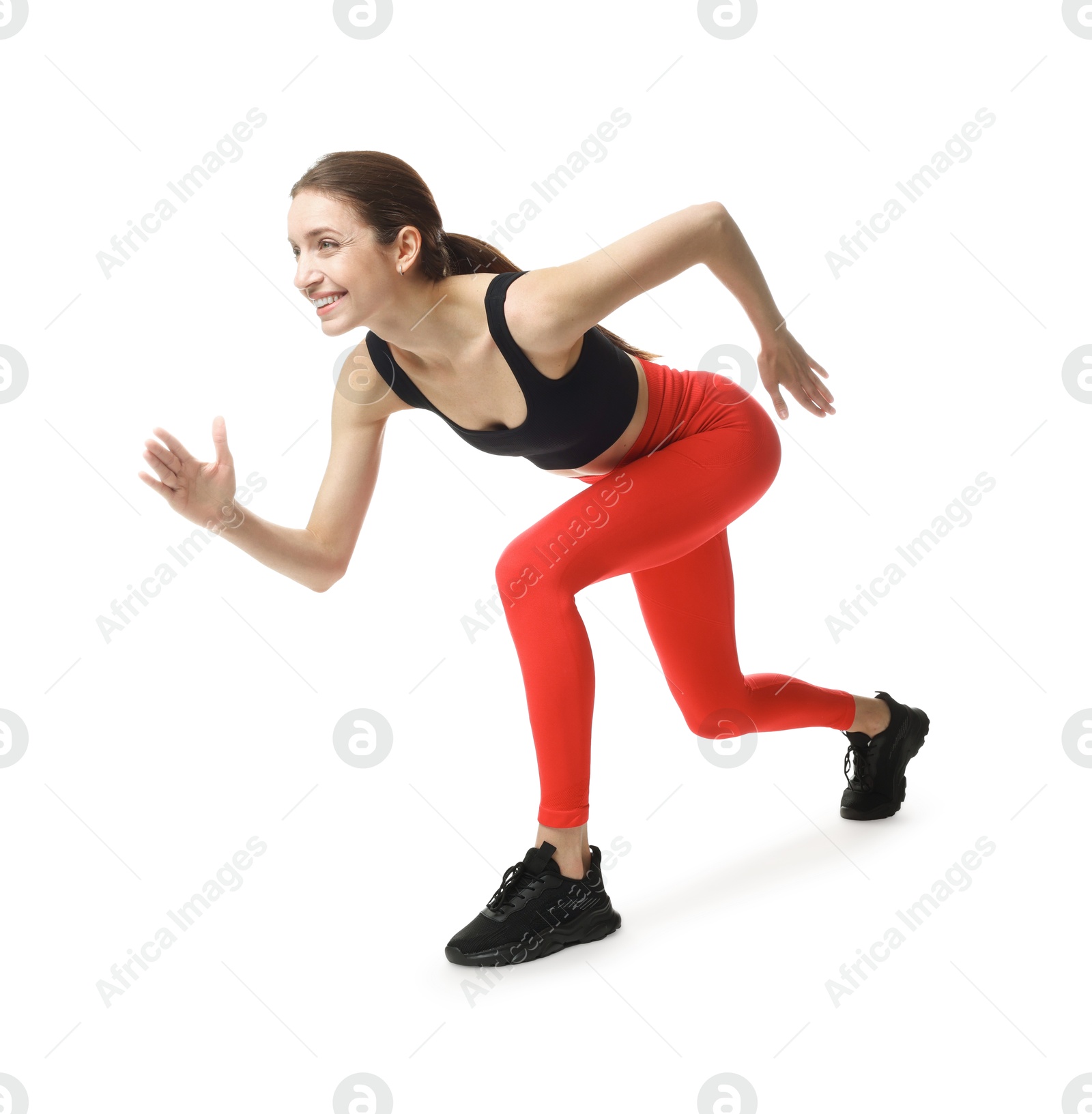 Woman in sportswear running on white background Photo of Woman in sportswear running on white background