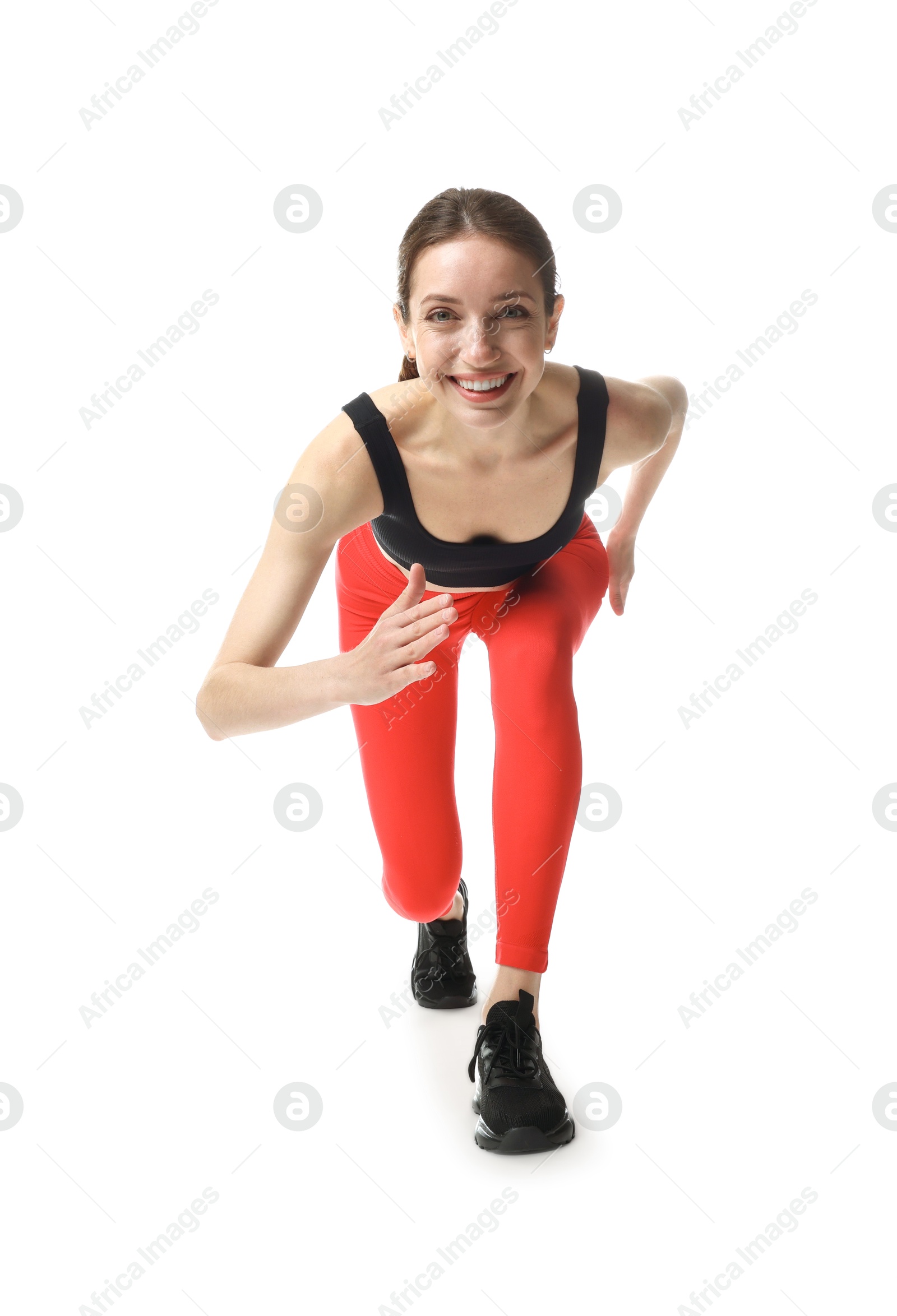 Woman in sportswear running on white background Photo of Woman in sportswear running on white background