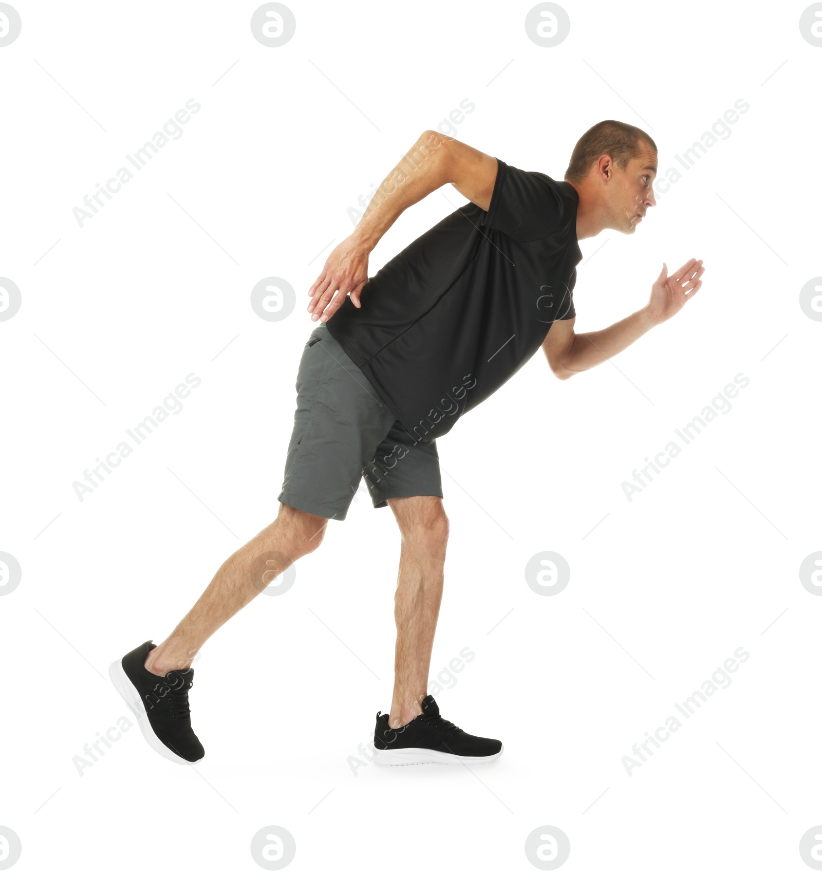 Man in sportswear running on white background Photo of Man in sportswear running on white background