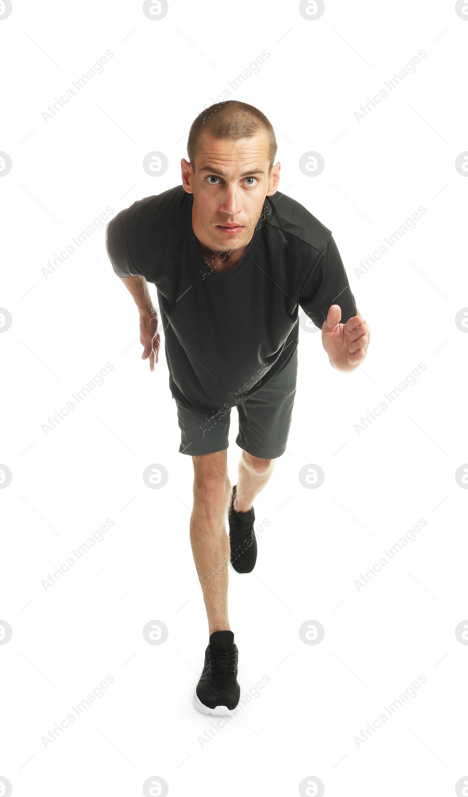 Man in sportswear running on white background Photo of Man in sportswear running on white background