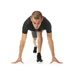 Photo of Runner in starting position on white background
