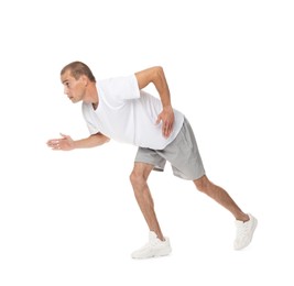 Photo of Man in sportswear running on white background