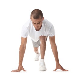 Photo of Runner in starting position on white background