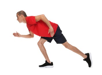 Photo of Man in sportswear running on white background