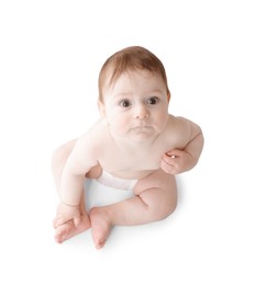 Photo of Cute little baby in diaper sitting on white background, above view