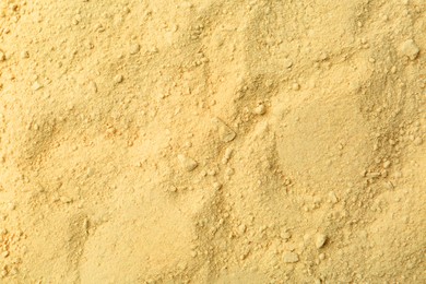 Photo of Superfood supplement. Wasabi powder as background, top view