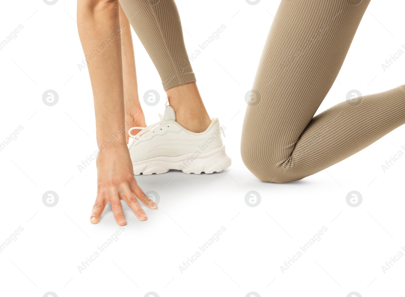 Runner in starting position on white background, closeup Photo of Runner in starting position on white background, closeup