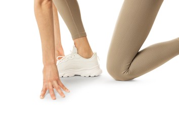 Photo of Runner in starting position on white background, closeup