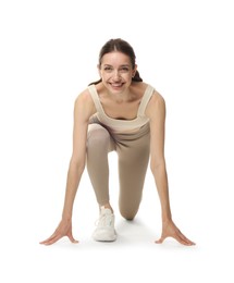 Photo of Runner in starting position on white background
