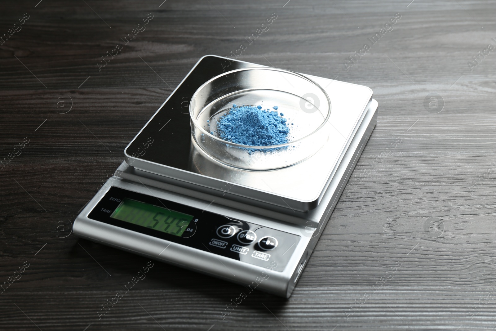 Laboratory scale with Petri dish of sample on wooden table, closeup Photo of Laboratory scale with Petri dish of sample on wooden table, closeup