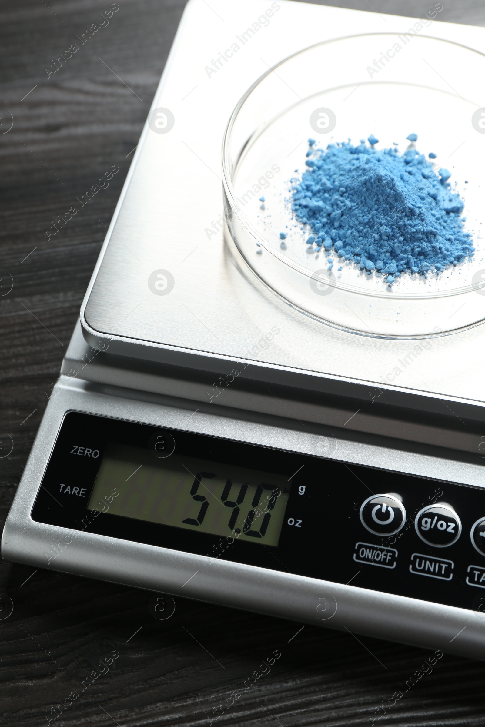 Laboratory scale with Petri dish of sample on wooden table, closeup Photo of Laboratory scale with Petri dish of sample on wooden table, closeup