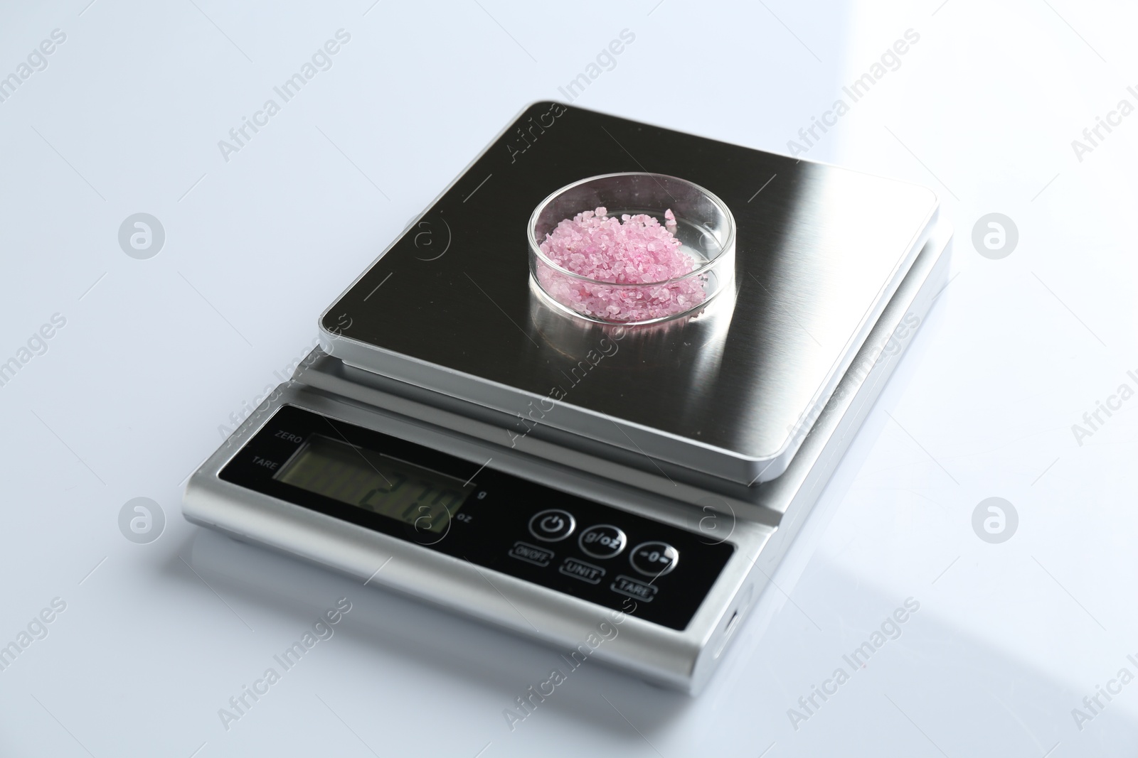 Laboratory scale with Petri dish of sample on white background, closeup Photo of Laboratory scale with Petri dish of sample on white background, closeup