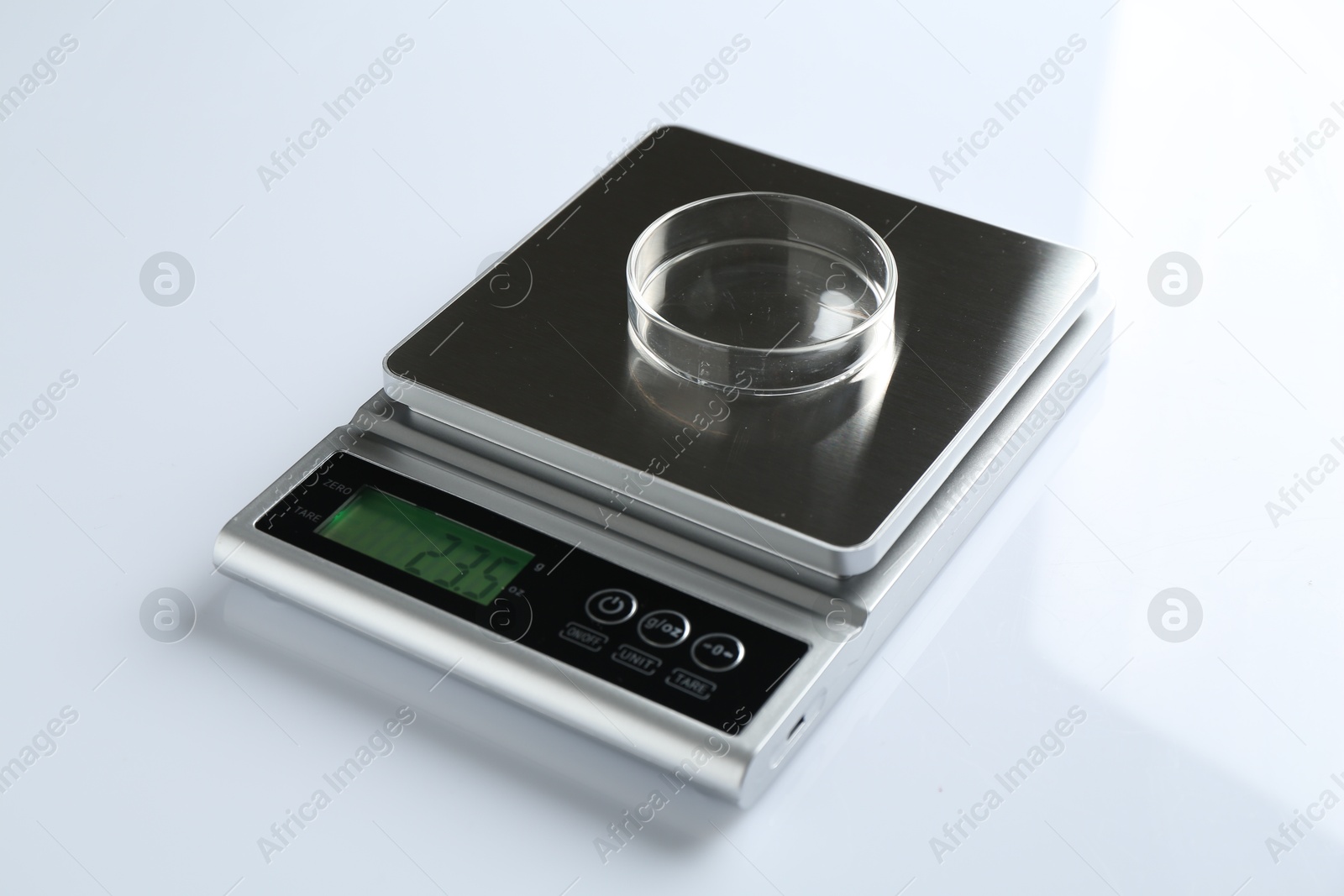Laboratory scale with Petri dish on white background, closeup Photo of Laboratory scale with Petri dish on white background, closeup