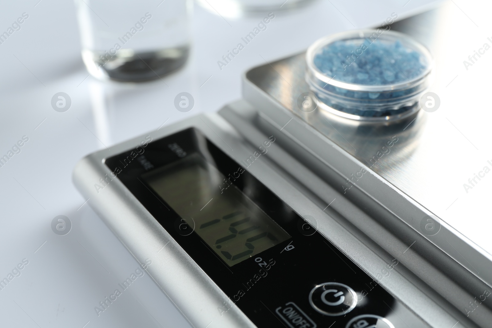 Laboratory scale with Petri dish of sample on white background, closeup Photo of Laboratory scale with Petri dish of sample on white background, closeup