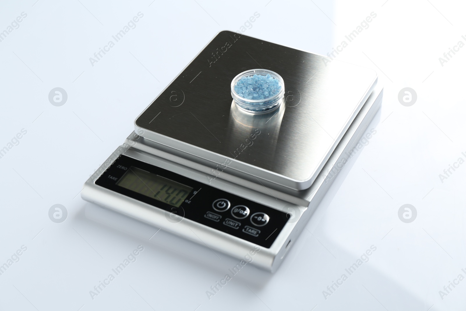 Laboratory scale with Petri dish of sample on white background, closeup Photo of Laboratory scale with Petri dish of sample on white background, closeup