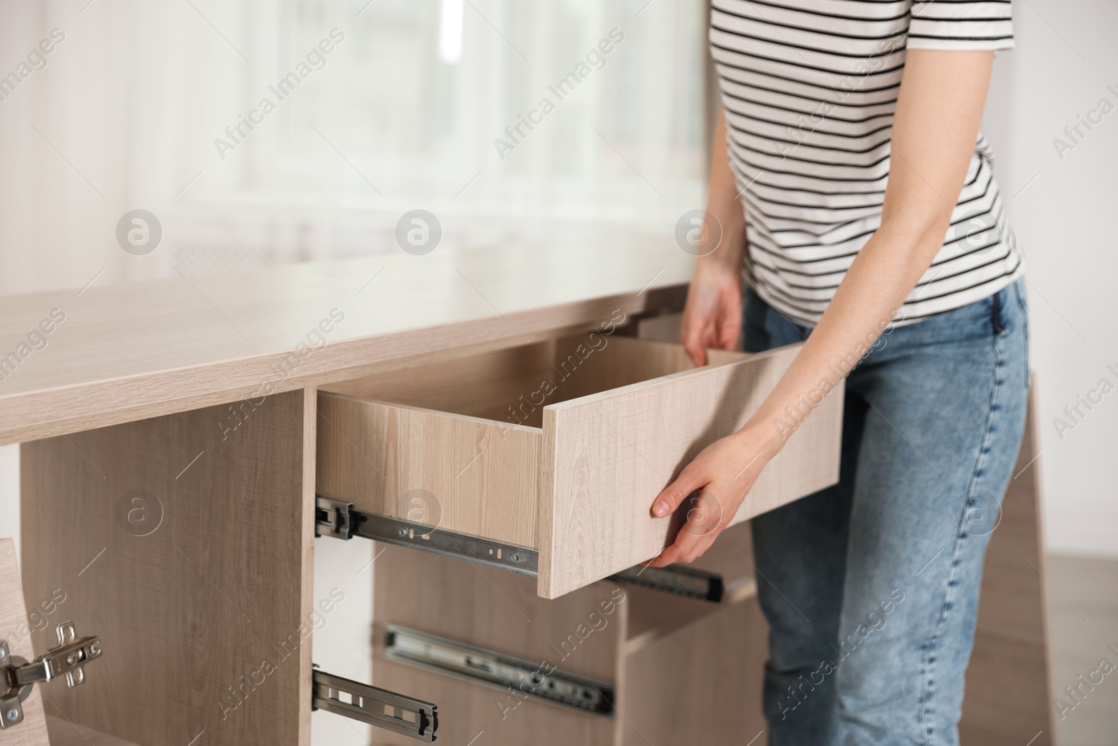 Self assembly furniture. Woman working with drawer at home, closeup Photo of Self assembly furniture. Woman working with drawer at home, closeup