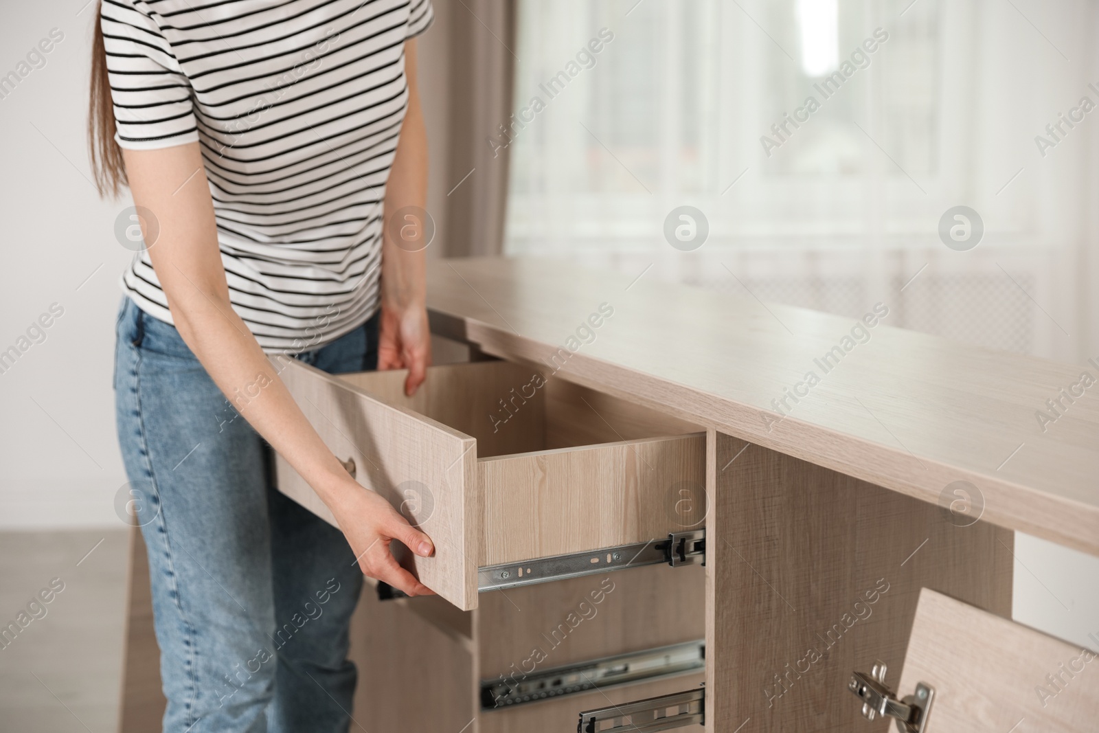 Self assembly furniture. Woman working with drawer at home, closeup Photo of Self assembly furniture. Woman working with drawer at home, closeup
