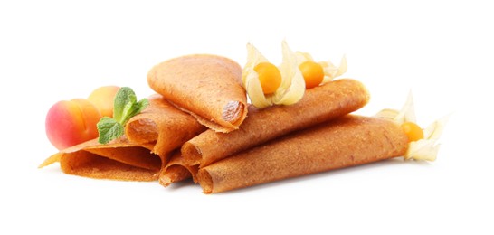 Photo of Delicious fruit leather rolls, apricots and physalis isolated on white
