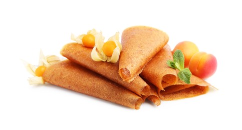 Photo of Delicious fruit leather rolls, apricots and physalis isolated on white