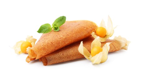 Photo of Delicious fruit leather rolls and physalis isolated on white