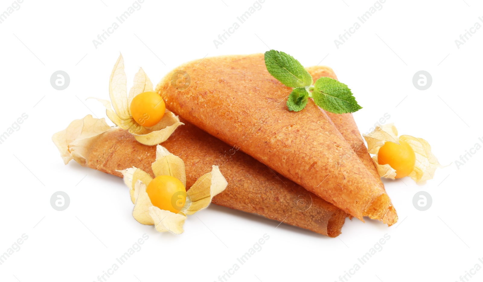 Delicious fruit leather rolls and physalis isolated on white Photo of Delicious fruit leather rolls and physalis isolated on white
