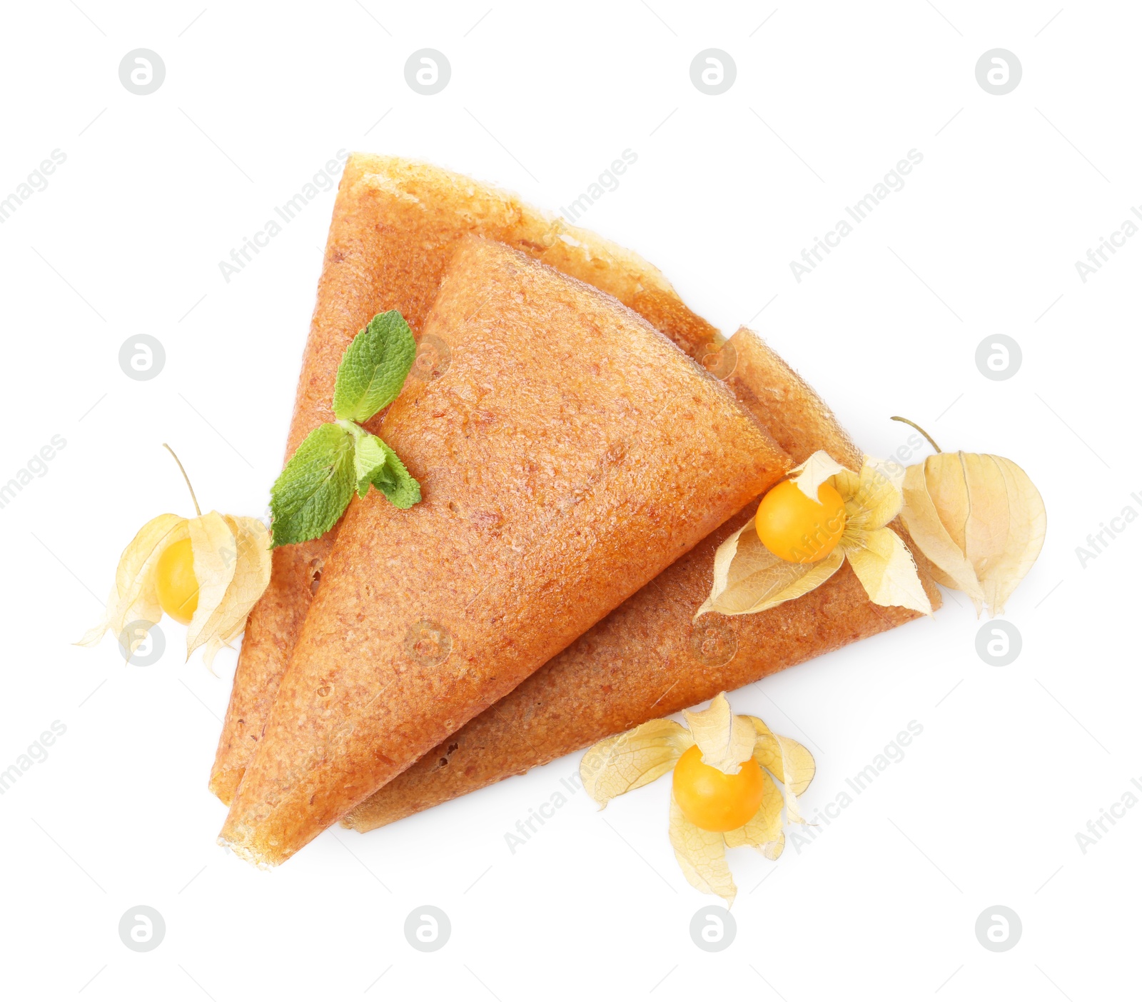 Delicious fruit leather rolls and physalis isolated on white, top view Photo of Delicious fruit leather rolls and physalis isolated on white, top view