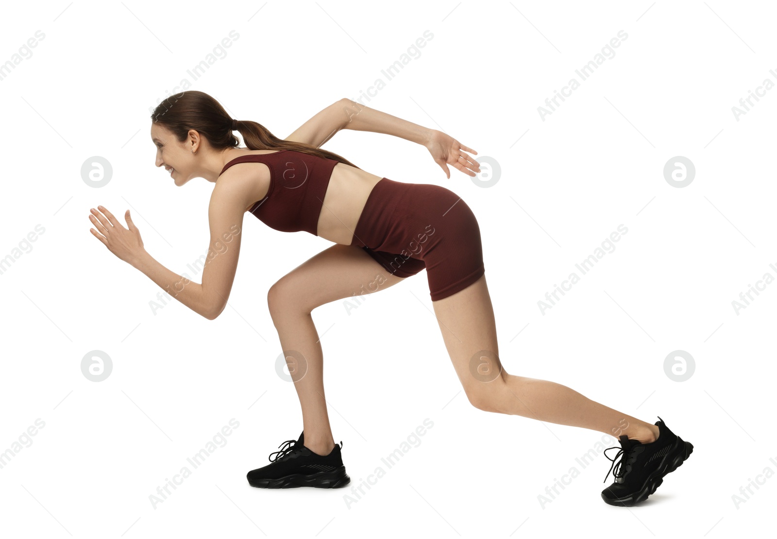 Woman in sportswear running on white background Photo of Woman in sportswear running on white background