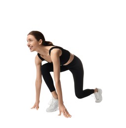 Photo of Runner in starting position on white background