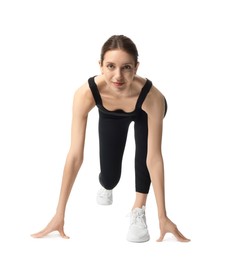Photo of Runner in starting position on white background